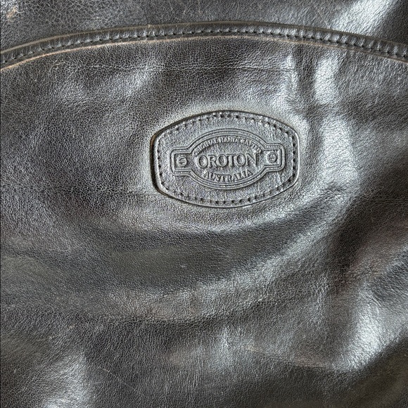 Oroton Black Leather Crossbody Bag with Gold Accents - Picture 3 of 11